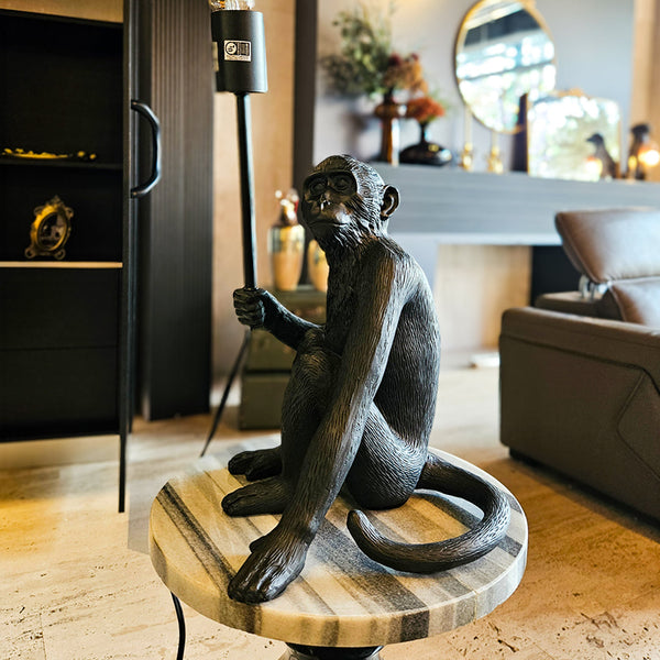 20" MONKEY WITH LIGHTBULB TABLE LAMP, BLACK